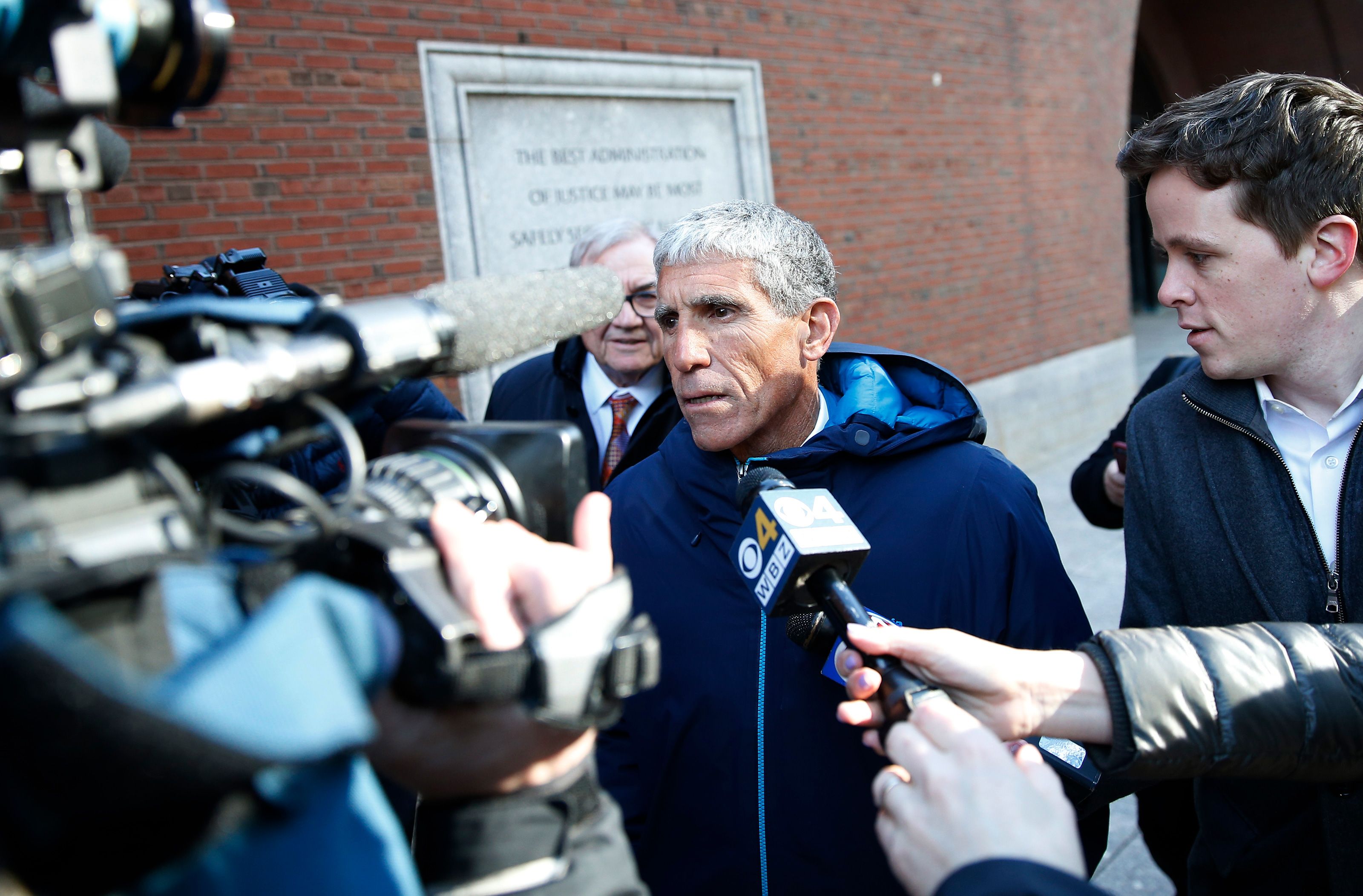 rick singer exiting a courthouse