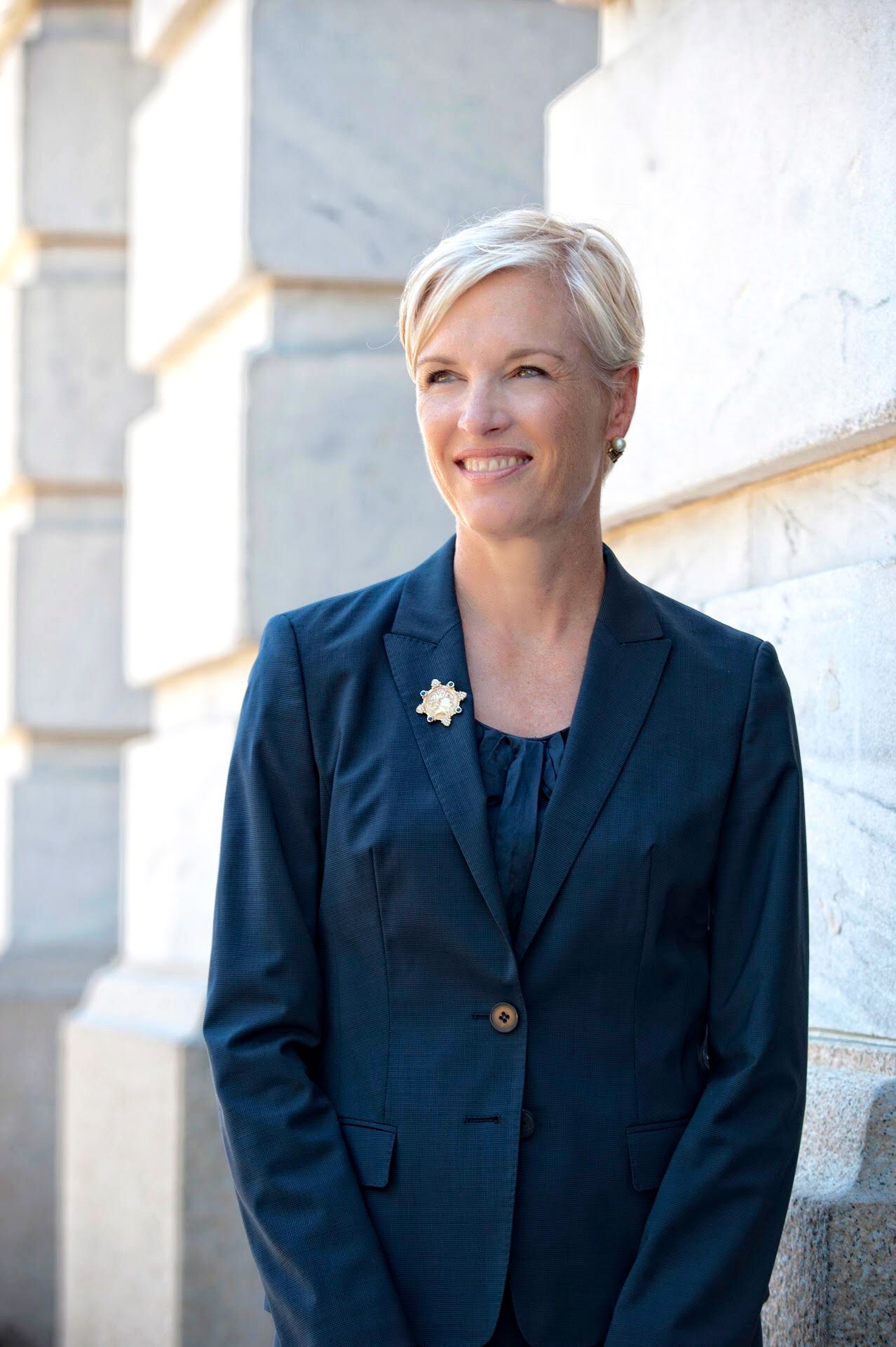 headshot of cecile richards wearing a navy blue suit